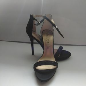 Black open toe strap on heels.